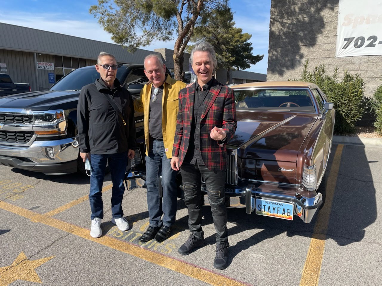 Chuck Panazzo and Lawrence Gowan of Styx join Jonathan Warren in the Stayfab Lincoln at Liberace Garage